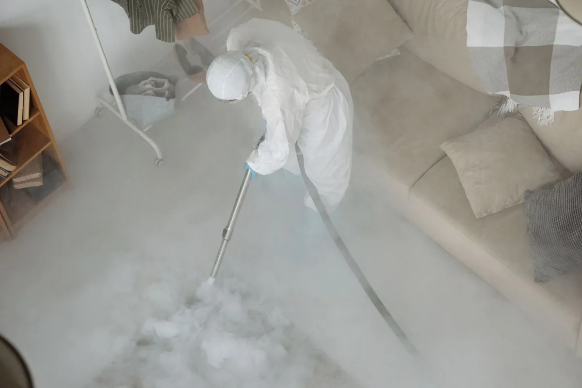 Biohazard cleanup technician in protective equipment, Bridgeport, WA